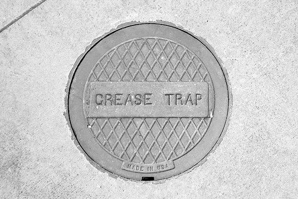 foul odors, slow draining sinks, and visible grease buildup are all indications that your grease trap needs pumping